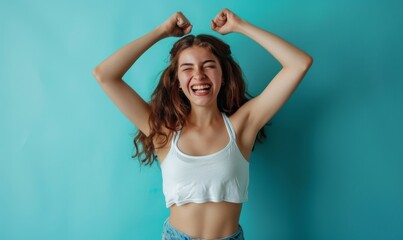 Fototapeta na wymiar Smiling woman standing confidently showing off her toned and beautiful body after achieving her diet goals