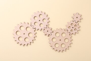 Business process organization and optimization. Scheme with wooden figures on beige background, top...
