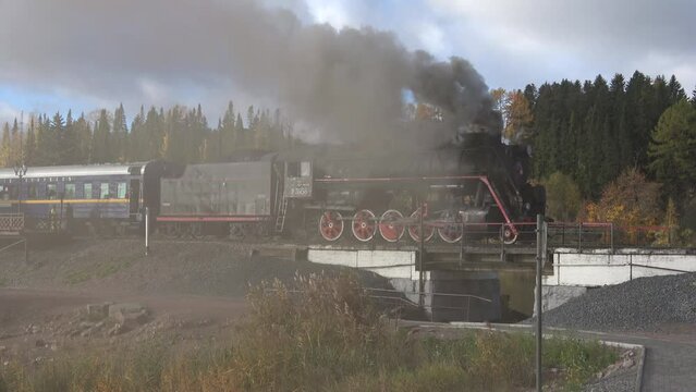 Old Soviet steam locomotive in smoke. Sortavala