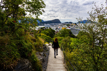 Young woman in Alesund city from view point, Norway, Europe