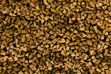 Stacks of firewood evenly placed.