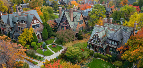 An aerial view of a 1920s Tudor neighborhood in Cleveland, highlighting the distinct architectural features and landscapes, with typical roof colors changed to shades of green and landscape