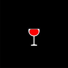 Glass red wine with a drop of drink inside  on black background