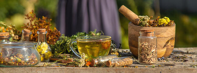 A woman brews herbal tea. Selective focus.