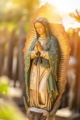 Sculpture depicting the Virgin Mary holding a sword in hand.