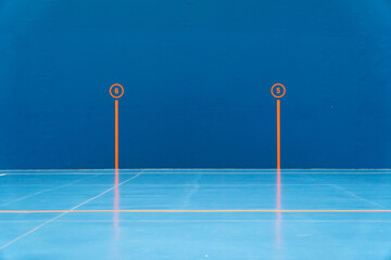 Blue wall in a basque ball court with score marks for practicing traditional spanish and french sport