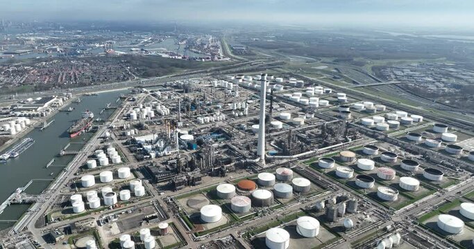 Petroleum refinery petrochemical complex in Pernis, in the port of Rotterdam, The Netherlands. Aerial drone view. Crude oil is processed into useful products such as gasoline, kerosene, diesel and raw
