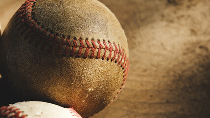 Old vintage used baseball texture closeup on ball with copy space on grunge background for sport.