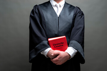 german lawyer with a robe and a book