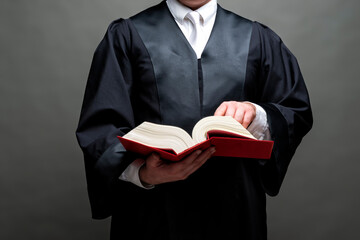 german lawyer with a robe and a book
