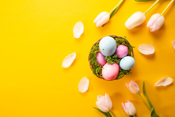  Easter eggs, flowers on yellow background. Greetings card, Happy Easters. Flat lay ,top view