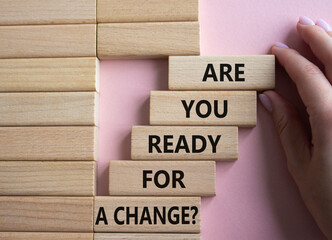 Change symbol. Wooden blocks with words Are you ready for a new change. Businessman hand. Beautiful...