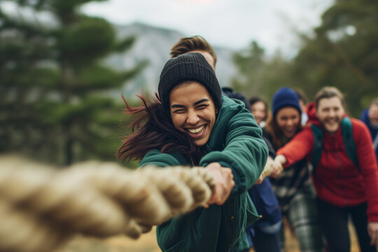 Tug of war game, dynamic team-building activity, People playing tug of war during a training, group of businesspeople pulling on a rope together during tug of war battle, Team competing in tug of war