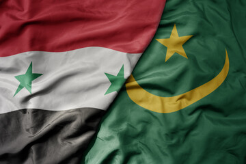 big waving national colorful flag of mauritania and national flag of syria .