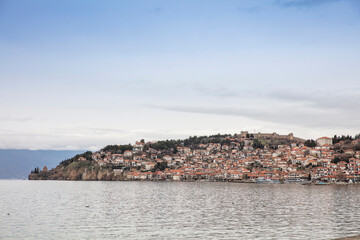 Ohrid old city reflected in Lake Ohrid, UNESCO World Heritage Site, Macedonia, Europe - 755894521