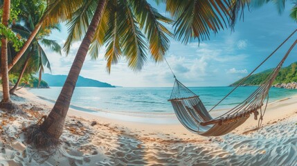 Tropical beach panorama as summer relax landscape with a hammock. The scene is peaceful and relaxing