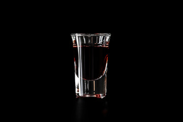 Shot glass with red drink