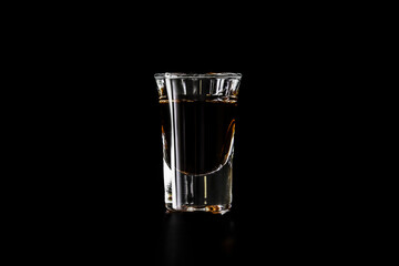 Shot glass with orange drink
