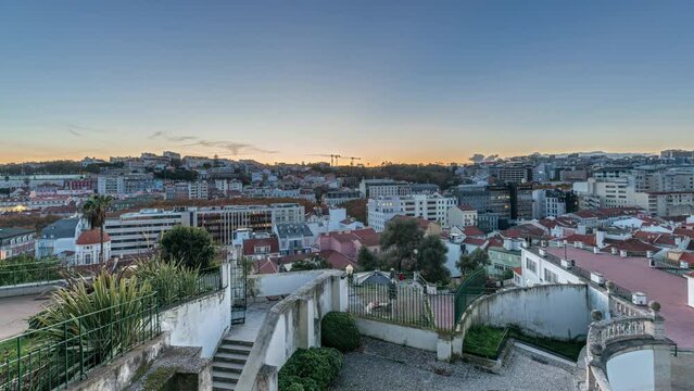 Panorama showing Jardim do Torel day to night transition timelapse, a traditional garden and viewpoint with unusual views to the city center of Lisbon. It has a terrace and a large pond. Portugal