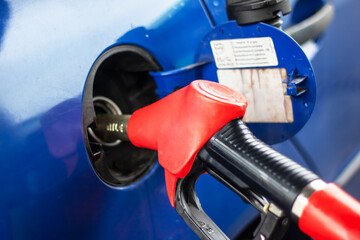 Refueling a car at a gas station