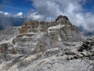 Fototapeta na wymiar Summit Ascent: High Exposed Adventure in Adamello Brenta, Bocchette, Dolomites