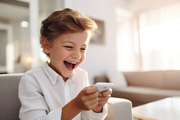 little kid using a smartphone at home concept