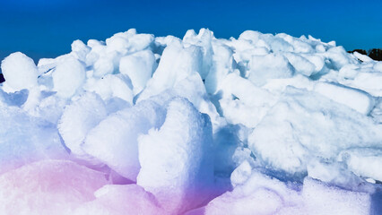 Heap of ice blocks against blue sky. Ice drift rocks in spring. Northern landscape. Travel North....