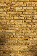 Obraz premium Seamless texture of a yellow brick wall, perfect for background or pattern use in design projects .