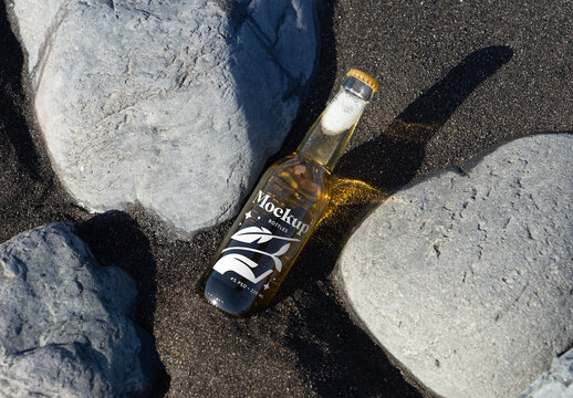Bottle Laying Between Stones Mockup