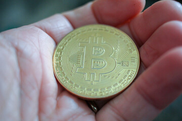 a bitcoin in my hand