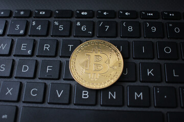 a bitcoin on a keyboard