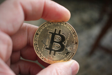 touching a symbol with my fingers. A bitcoin