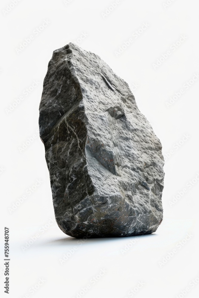 Poster a large rock resting on a white surface. perfect for backgrounds or textures.
