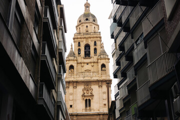 Murcia cathedral background. Narrow street view. Traveling around Spain. Cityscape spanish...