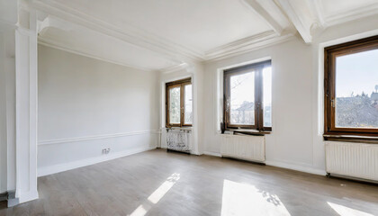 an empty room with wood flooring and white paint on the walls there is a large window in the corner. Copy space image. Place for adding text or design