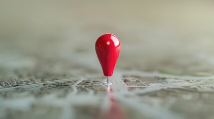 Fototapeta premium A red pin placed on top of a map, suitable for navigation concepts.