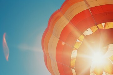A hot air balloon with the sun shining through it. Perfect for travel and adventure concepts.
