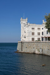 Fototapeta na wymiar Trieste, Italy - September 26, 2023: 19th-century eclectic style Miramare Castle (Castello di Miramare), located directly on the Gulf of Trieste of the Adriatic Sea
