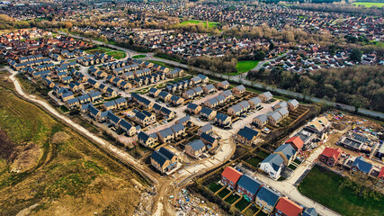 Aerial view of a suburban neighborhood with rows of houses, showing development and urban planning in Harrogate, North Yorkshire.