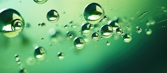 Macro photography capturing water drops on a green grass surface, showcasing the beauty of fluid dynamics in nature