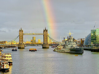 Rainbow over Tower Bridge, and the ships on the Thames, in London, England