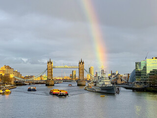 Rainbow over Tower Bridge, and the ships on the Thames, in London, England