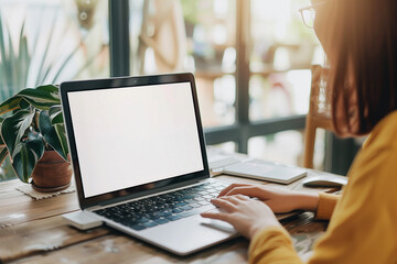 Fototapeta premium Woman working on her laptop in a home office remote work, mockup