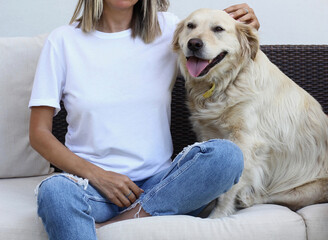 Girl in blank white t shirt sitting with dog. Woman wearing blank white T-shirt for mockup ,pet design