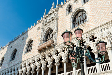 Ornate Exterior of Doge's Palace with Venetian Lamp Posts