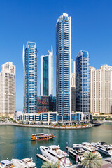 Dubai Marina skyline cityscape with yachts skyscraper buildings living at water portrait format - 755990573