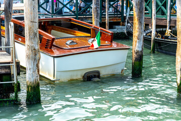 Venice Water Taxi Docked at Wooden Piers