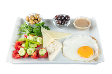 Turkish Cuisine Breakfast Plate. Rich and delicious Turkish breakfast on white wood table.  Healthy Turkish breakfast in the bright morning; copy space for text.