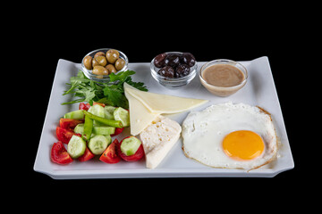 Turkish Cuisine Breakfast Plate. Rich and delicious Turkish breakfast on white wood table.  Healthy Turkish breakfast in the bright morning; copy space for text.
