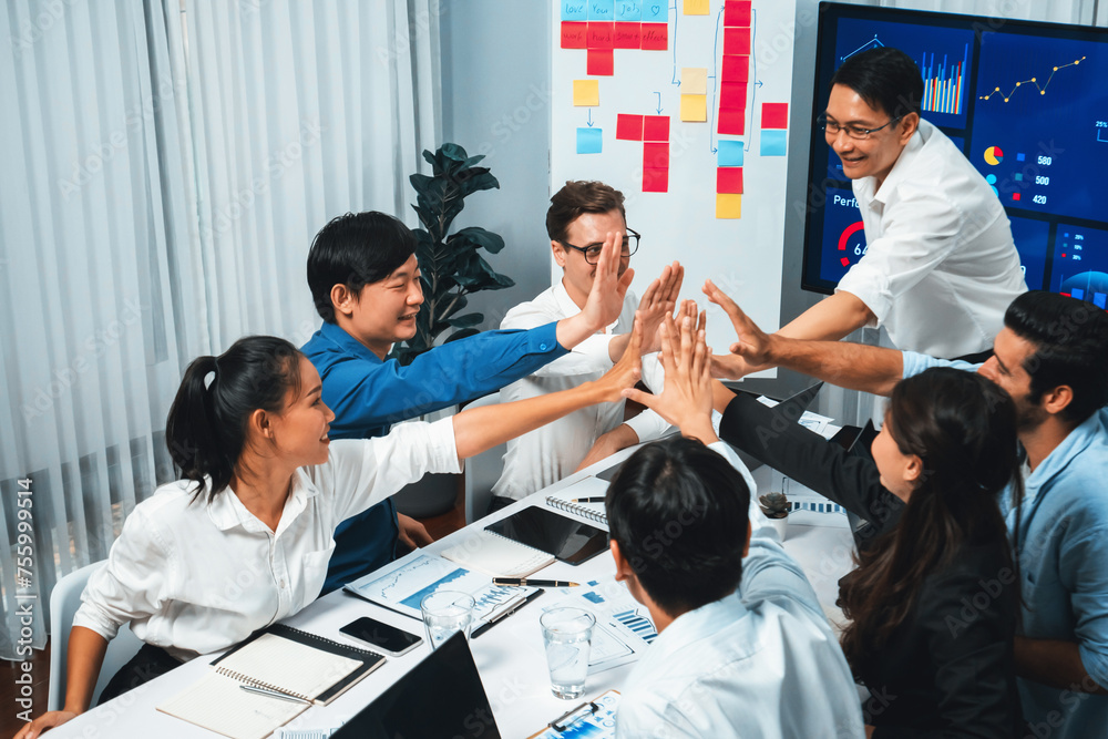 Leinwandbilder analyst team leader celebrate and high five together with his colleague after successful data analys